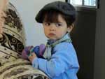 Juliana Camerini Corr�a P�rez: "nesta imagem, meu sobrinho Miguel Camerini P�rez Garcia estava pronto para assistir ao desfile do dia 20 de setembro na cidade de Jaguar�o, cidade onde vive com seus pais e irm�o. Minha irm� Cl�udia aproveitou um momento em que ele estava um pouco sonolento, pois n�o gosta muito de posar para fotos, mas no imprevisto as cenas s�o as melhores. Ele est� com o Dino na m�o, um radinho que a madrinha dele deu, pois adora um som"