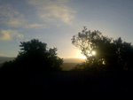 Sol nascendo sobre Canela, visto de Gramado