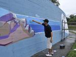 Grafiteiros comeam a pintar o muro do Jornal de Santa Catarina em comemorao aos 45 anos do Santa.