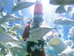 Papai Noel cai ngua e alimenta peixes em aqurio de zoolgico da Tailndia