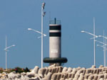 Praia do Atalaia com o farol da barra do Rio Itaja-A.